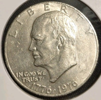 (1) 1976-P Ike Bicentennial Dollar Coin, (1) 2007-S Wyoming State Quarter, (1) 1978-D Jefferson Nickel Denver Mint Nickel, (1)1985-D BroadStrike Roosevelt Dime Denver Mint, (1) 1946-S Misaligned Die Lincoln Wheat Penny, (1) 1940-P Lincoln Wheat Penny, (2) - 4