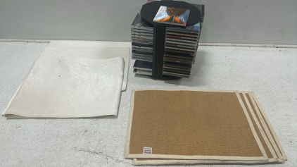Revolving DVD/CD Case Holder, (72) Collection of CD/DVDs, (4) Cost Plus Woven Table Mats, Table Runner Set with (2) Table Mats