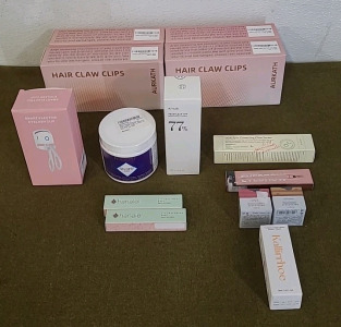 (1) Smart Electric Eyelash Clip, (1) 90-Gram Container Of Namoi Collagen Renewal Matrix, (1) 8.45-FlOz Bottle Of Anua Soothing Toner, (2) 0.53-Oz Tubes Of Hanalei Lip Treatment, Rose, & More