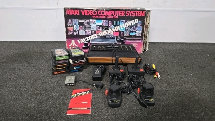 (1) Atari Video Computer System with 12 Games, 2 Joystick Controllers, 2 Paddle Controllers and More!