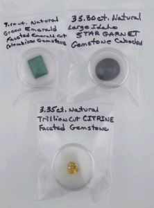 (1) 9.10ct. Natural Green Emerald Faceted Emerald Cut Colombian Gemstone, (1) 35.50ct. Natural Large Idaho Star Garnet Gemstone Cabochon, & (1) 3.35ct. Natural Trillion Cut Citrine Faceted Gemstone