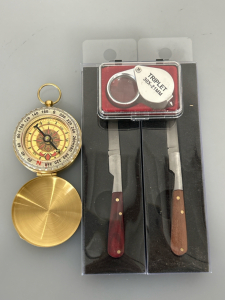 Brass Toned Compass with Gliw in The Dark Dial, (2) Texas Toothpick Knives and (1) Jewelers Loupe