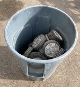 Garbage Can Full of Toy Wheels of Various Sizes