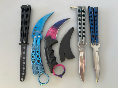 (2) Butterfly Knives, (1) Practice Knife, And (2) Claw Shaped Knives