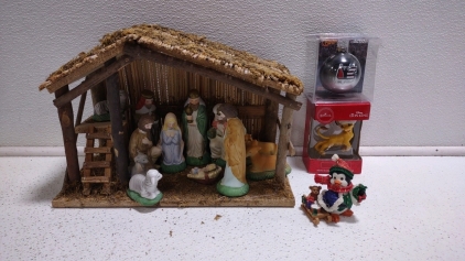 (1) Vintage Nativity Holy Family Figurines w/ Stable, (1) Disney "The Lion King"-Simba Christmas Ornament, (1) Christmas Penguin Riding Sled Christmas Ornament, & (1) Dale Earnhardt Christmas Ornament