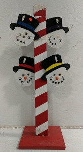 (1) Festive Snowman Pole Stand – 4 Snowman Faces on Candy Cane Striped Post