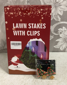 (1) Box of Lawn Stakes With Clips (1) Pair of Bedazzled Christmas Tree earrings