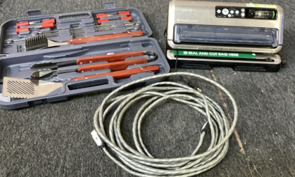 VERY NICE SET IF GRILLING UTENSILS, FOOD SAVER VACUME SEALER, GE LONG HDMI CORD.