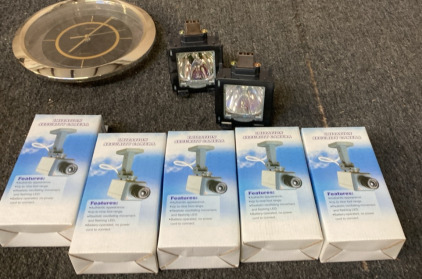 2 PROJECTOR REPLACEMENT BULBS. SMALL SUNBEAM WALL CLOCK, 5 IMITATION SECURITY CAMERAS.