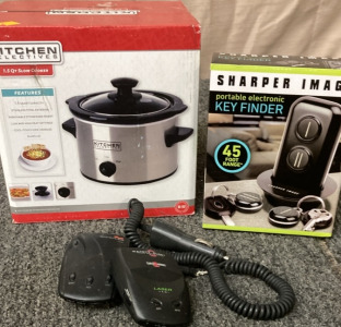 1.5 QT KITCHEN SELECTIVES SLOW COOKER (PAKAGE UNOPENED). SHARPER IMAGE KEY FINDER (PAKAGE UNOPENED). RADAR DETECTORS.