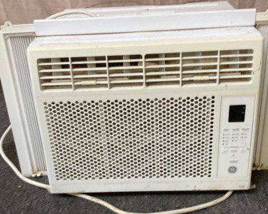 GE SMALL WINDOW AC UNIT. (TESTED DOES TURN ON):