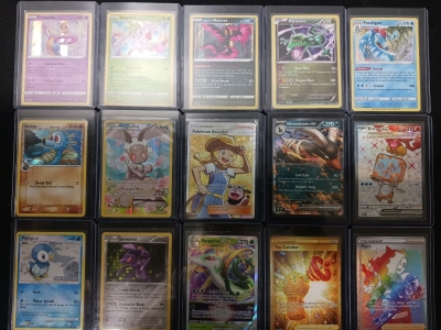 Variety Of Pokémon Cards In Protective Cases