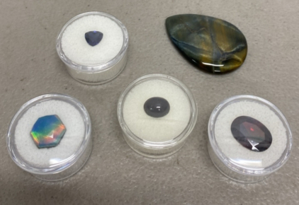 (1) Natural Fire Opal Doublet Gemstone (1)Natural Blue Sapphire Facted Trillion Cut Gemstone 8x8mm (1) Natural Blue Tiger Eye Jasper Flashy High Quality Gemstone Cabochon (1) Pigeon Blood Red Ruby Oval Cut Faceted VVS Diamond Cut Gemstone (1) Natural Idah