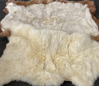 FUR RUG, LARGE PIECE OF LAMB SKIN.