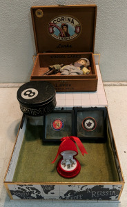 (7) Collectibles Lot w/ (1) Vintage Corina Larks Cigar Box w/ Miniature Dolls (1) Vintage Camel 8-Ball Tin (2) Military Coins (1) Felt-Lined Display Box (1) Hallmark Ornament Nativity Set in Felt Bell