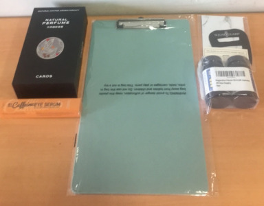 (1) Clipboard (1) 5% Caffeine Eye Serum (1) Tie Square Guard & an Amazon Returns Box (perch)