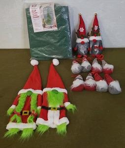 (1) Pull Over Christmas Tree Cover, (1) Set Of Gnome Christmas Tree Toppers, (2) Gnome Table Decorations, (8) Gnome Ornaments & (1) Box Of Assorted Christmas Decor