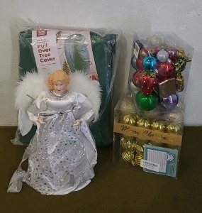 (1) Pull Over Christmas Tree Cover, (1) Silver Angel, Lighted Tree Topper, (2) Containers Of Christmas Tree Ornaments & (1) Box Of Assorted Christmas Decor