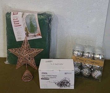 (1) Pull Over Christmas Tree Cover, (1) Gold Wire Star Tree Topper, (1) String Of 200 LED Lights, (1 ) Container Of Christmas Tree Ornaments & (1) Box Of Assorted Christmas Decor