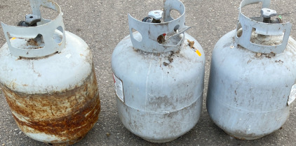 Three Medium Sized Propane Tanks