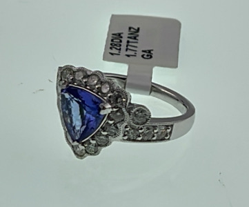 Platinum 1.77kt. Triangular Cut And Faceted. Natural Tanzanite Zoisite And Round Cut And Faceted 1.28kt. Diamond Ring Size 6-1/2 (Retail Value $15,740.00)