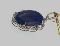 Platinum Natural Burmese Sapphire Corundum (19.15ct) Diamond (0.14ct) Pendent. Oval Cabochon Cut Natural Blue Burmese Sapphire Corundum Gemstone Retail $11,540 - 2