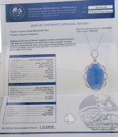 Platinum Natural Burmese Sapphire Corundum (19.15ct) Diamond (0.14ct) Pendent. Oval Cabochon Cut Natural Blue Burmese Sapphire Corundum Gemstone Retail $11,540 - 7