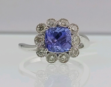 Platinum Natural Tanzanite Zoisite And Diamond Ring (size 6.5) Cushion Brilliant Cut Natural Tanzanite Zoisite Gemstone (1.87ct) Round Brilliant Cut Diamonds Accent Center Stone (0.70ct) Retail Value $11,570.00