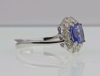 Platinum Natural Tanzanite Zoisite And Diamond Ring (size 6.5) Cushion Brilliant Cut Natural Tanzanite Zoisite Gemstone (1.87ct) Round Brilliant Cut Diamonds Accent Center Stone (0.70ct) Retail Value $11,570.00 - 2