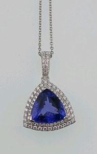 Platinum Natural Tanzanite Zoisite and Diamond Pendent with Chain Triangle Brilliant Cut Natural Tanzanite Zoisite Gemstone (8.04ct) 75 Round Brilliant Cut Diamonds Accent Pendant Around and Both Sides of Center Stone (1.28ct) Retail Value $46,720.00