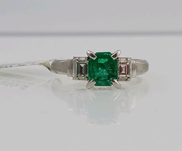 Platinum Diamond and Emerald Ring (size 5) Emerald Cut Natural Emerald (0.57ct) 2 Baguette Natural Diamonds (0.32ct) Retail Value $9,470.00