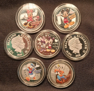 (7) Disney Character Silver Plated Collectible Coins