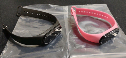 (2) Fit Bit Watches; (1) Black (1) Pink