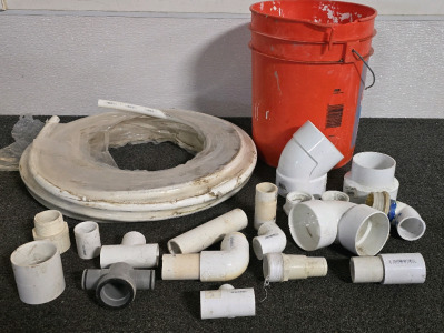 Bucket Of Assorted PVC Couplings And Roll Of 3/4 Shark bite PVC Tubing