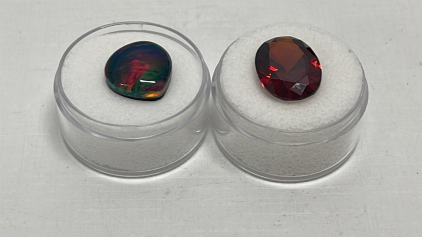 (1) 5.70ct. Natural Fire Opal Teardrop Doublet Ring Sized Cabochon, (1) 10.35ct. Pidgeon Blood Oval Cut And Faceted Diamond Cut Red Ruby Gemstone