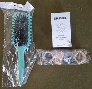 (1) 1.69FLOz Bottle Of Dr Pure First Aid Deep Repairing Hair Oil, (1) Hair Brush, (4) Metal Hair Clips & (1) Box Of Assorted Amazon Overstock/ Returns