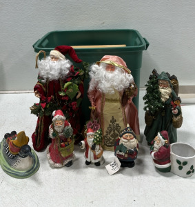 Collection of Various Santa Holiday Statues: Poinsettia Santa Statue, Ornate Victorian Santa Statue, Santa with Toys Statue, From Out of the North Woodcarving Statue, Santa Candle Holder, and More Holiday Statues