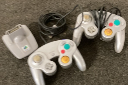 PAIR OF VINTAGE GAME CUBE CONTROLLERS.