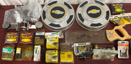 Chevy Hubcaps, Hand Saw, Assorted Nails, Staples, And Screws