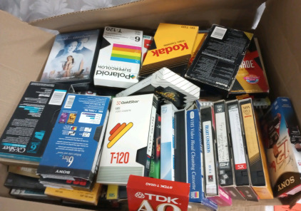 (1) Box Of DVDs (1) Box Of VHS Video Cassettes