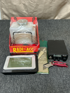 Radiator Coolant Overflow Accumulator, Cobra Radio, Alarm Clock, Box Cutter Knife and The Slide Rule