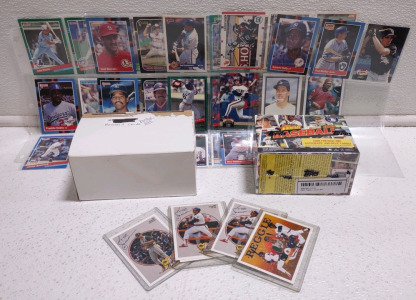 (1) Unopened Box of Baseball Player Cards, (1) Opened Box of Baseball Player Cards, (4⅓) Pages of Cards, & (4) Reggie Baseball Player Cards 3 out of 9