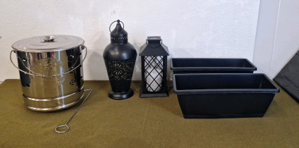 (1) Metal Candle Lantern, 15"T, (1) Solar LED Candle Lantern, 11"T, (2) Planter Pots 16" x 6" x 5" & (1) Small Stainless Steel Fire Barrel