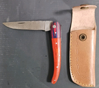 (1) Damascus Folding Knife w/ Red and Blue Handle And Leather Sheath