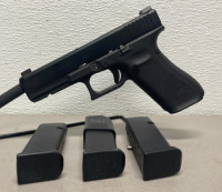 Glock Model 17 Gen 5 9mm Caliber Revolver In Original Box, Two Extra Magazines, Speedloader, And Extra Grips