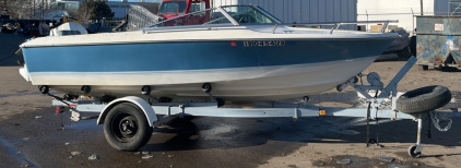 (1) 18’ White and Blue Fishing Boat with Johnson 90 Motor (1) EZ Loader 20’ Single Axle Trailer