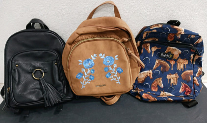 (3) Backpacks - (1) Black BOC Backpack (1) Tan Wallflower Backpack (1) Horse-Themed SAX Backpack