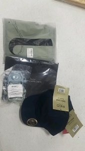 (3) Headache Caps, (1) Three Year Planner 2024-2026, (1) Pair of Womens Maternity Yoga Tights (2) Packages of Paper Bread Bags, (1) Baby Teething Toys, (7) Bags of Party Decor, (4) Satin Lined Hats, and More!