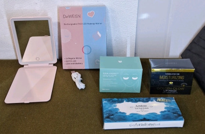 (1) DeWeisn Rechargeable PAD LED Makeup Mirror, (1) Box Of Cicaluronic De-Puffing Eye Patches, (1) Box Of Dermora Golden Glow Lip Masks & (1) 6-Bottle Set Of Gel Nail Polish
