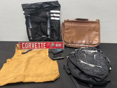 (2) Black Backpacks- Adidas and Outdoor Products, (1) Brown Leather Satchel, (2) Wallets, (1) Corvette blvd sign and more!